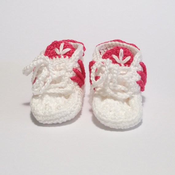 White and pink baby shoes