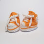 White and orange baby shoes