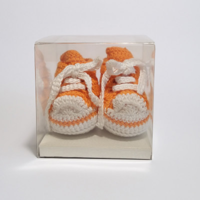 White and orange baby shoes