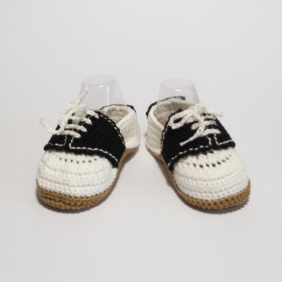 White and black baby shoes
